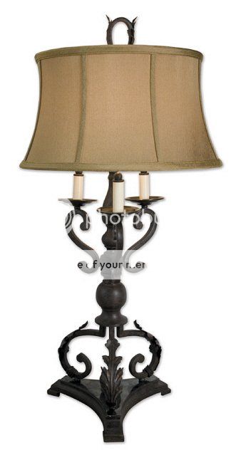 This table lamp is finished in a mahogany bronze with plated Bobeches 